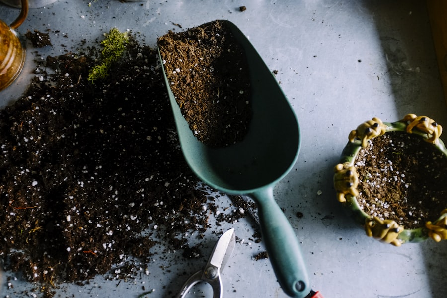 Garden trowel with fresh soil ready for planting